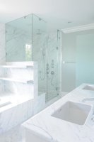 shower-next-to-marble-tub-marbel-floating-shelves-over-tub