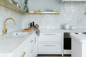 keren-richter-selected-an-unlacquered-brass-faucet-by-studio-ore-to-sit-above-a-white-arrow-custom-designed-integrated-marble-sink-in-this-pre-war-berlin-renovation